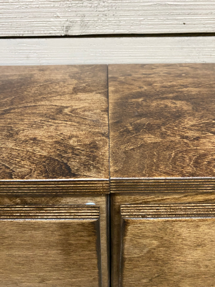 Quad laundry with a storage drawer in warm brown stain