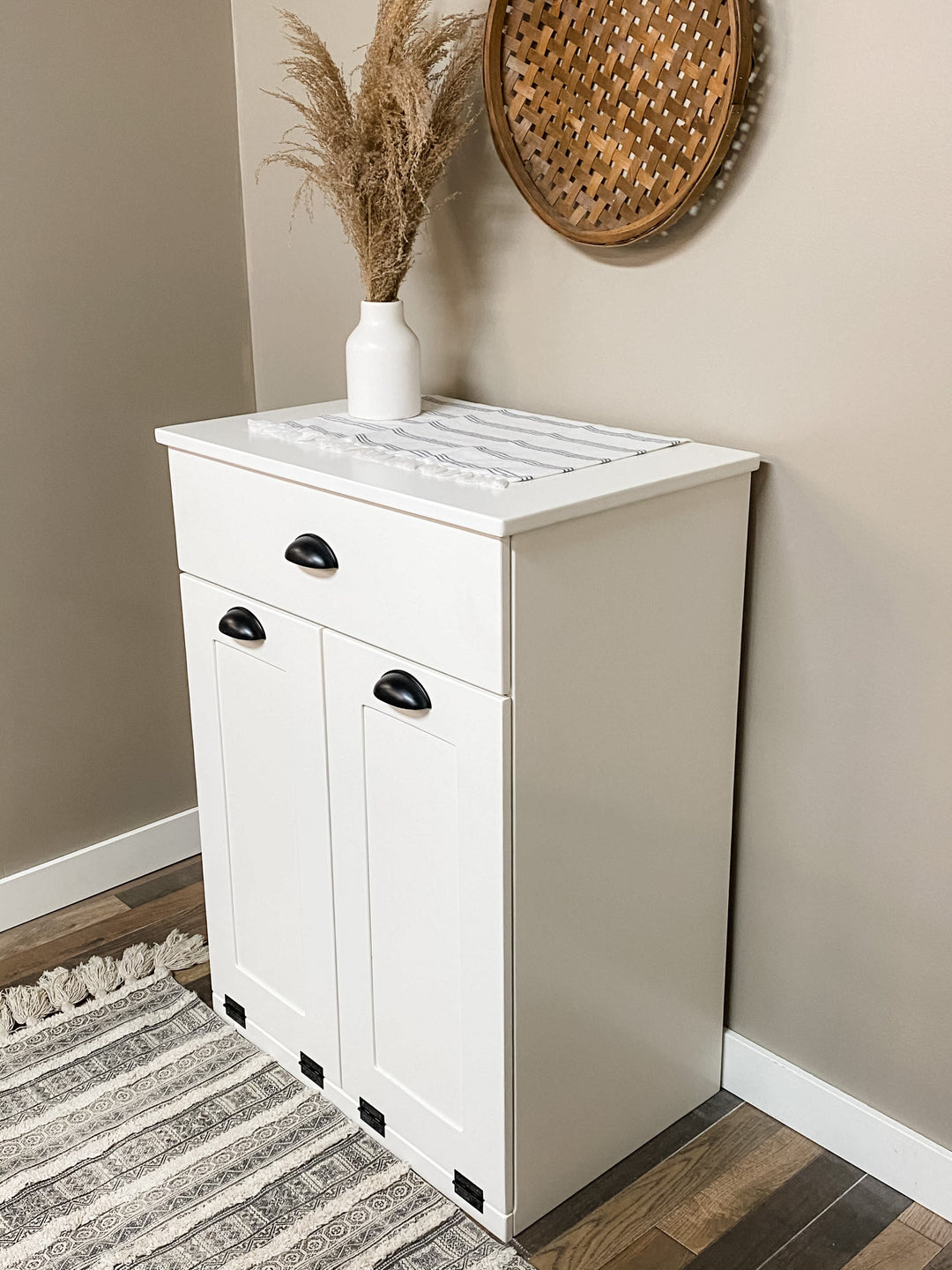 Narrow double cabinet to hide trash with a storage drawer in white