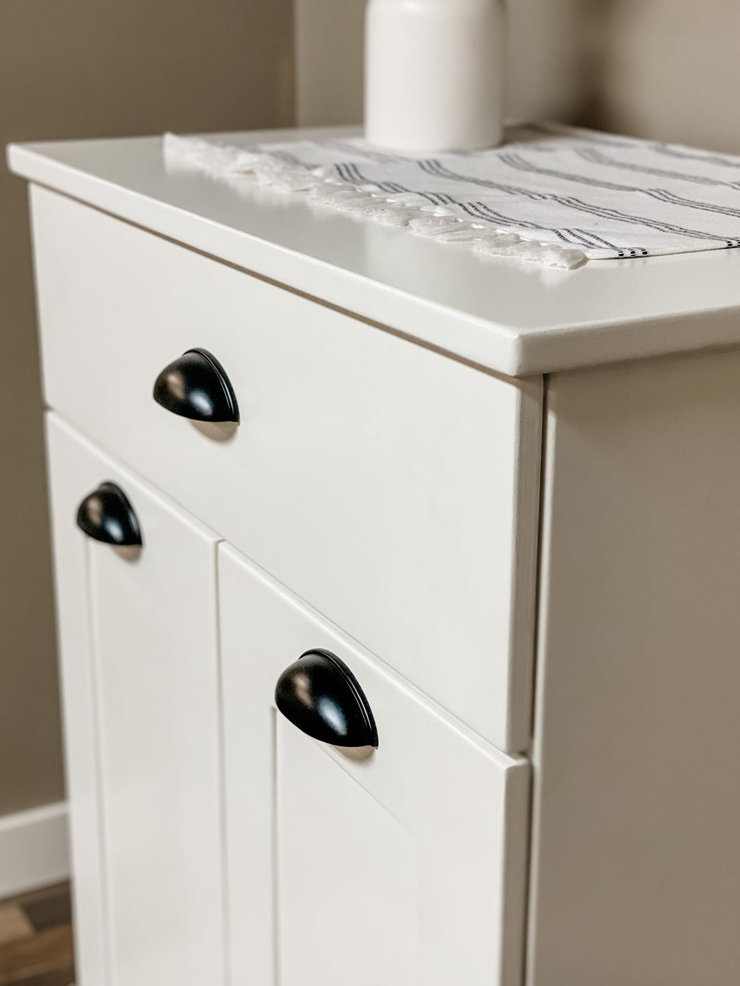 Narrow double cabinet to hide trash with a storage drawer in white