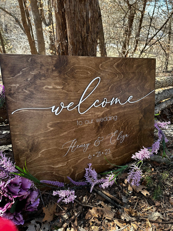 Personalized "welcome to our wedding" sign in fine-line script