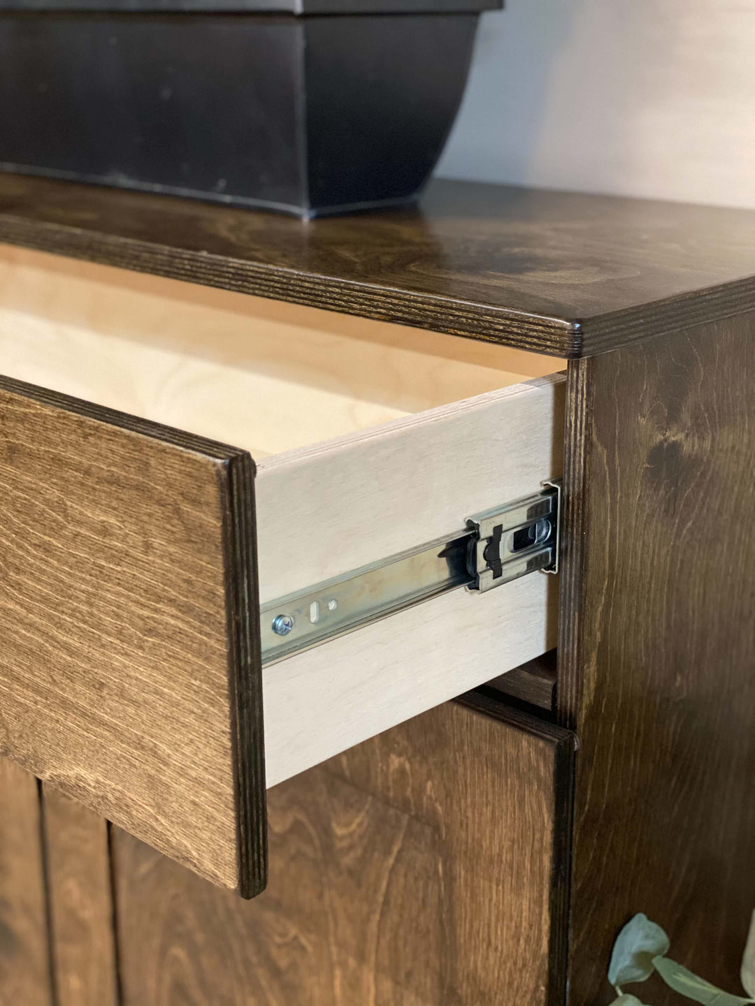 Counter tall 4 bin trash cabinet with a storage drawer in dark brown stain