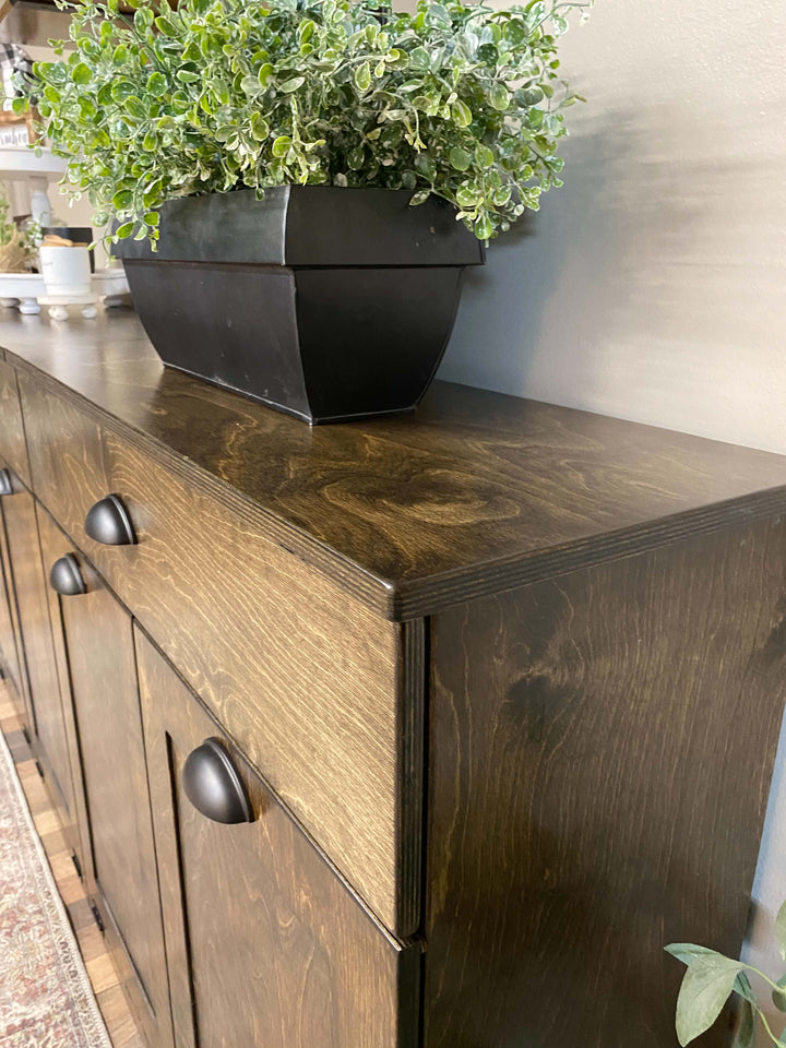 Counter tall 4 bin trash cabinet with a storage drawer in dark brown stain