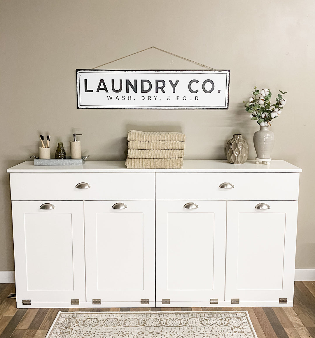 Four bin laundry sorter with a storage drawer in white