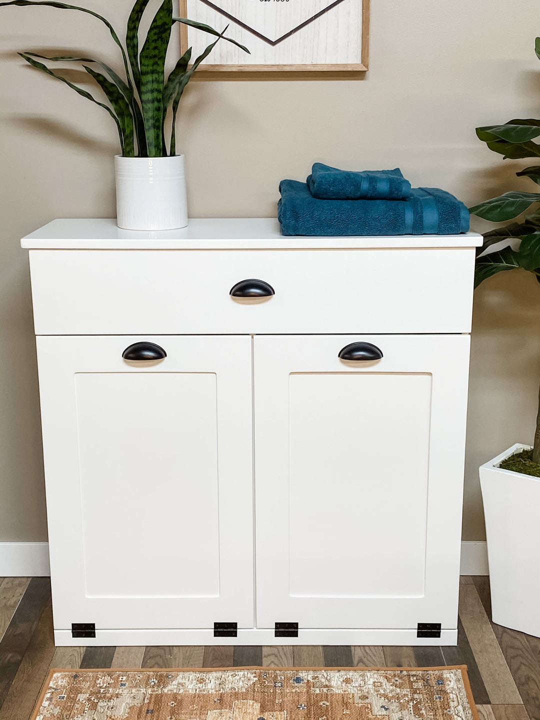 White furniture style laundry double hamper with a storage drawer